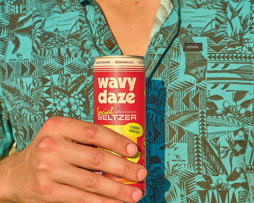 wavy daze cherry limeade can in hand with tropical button down shirt